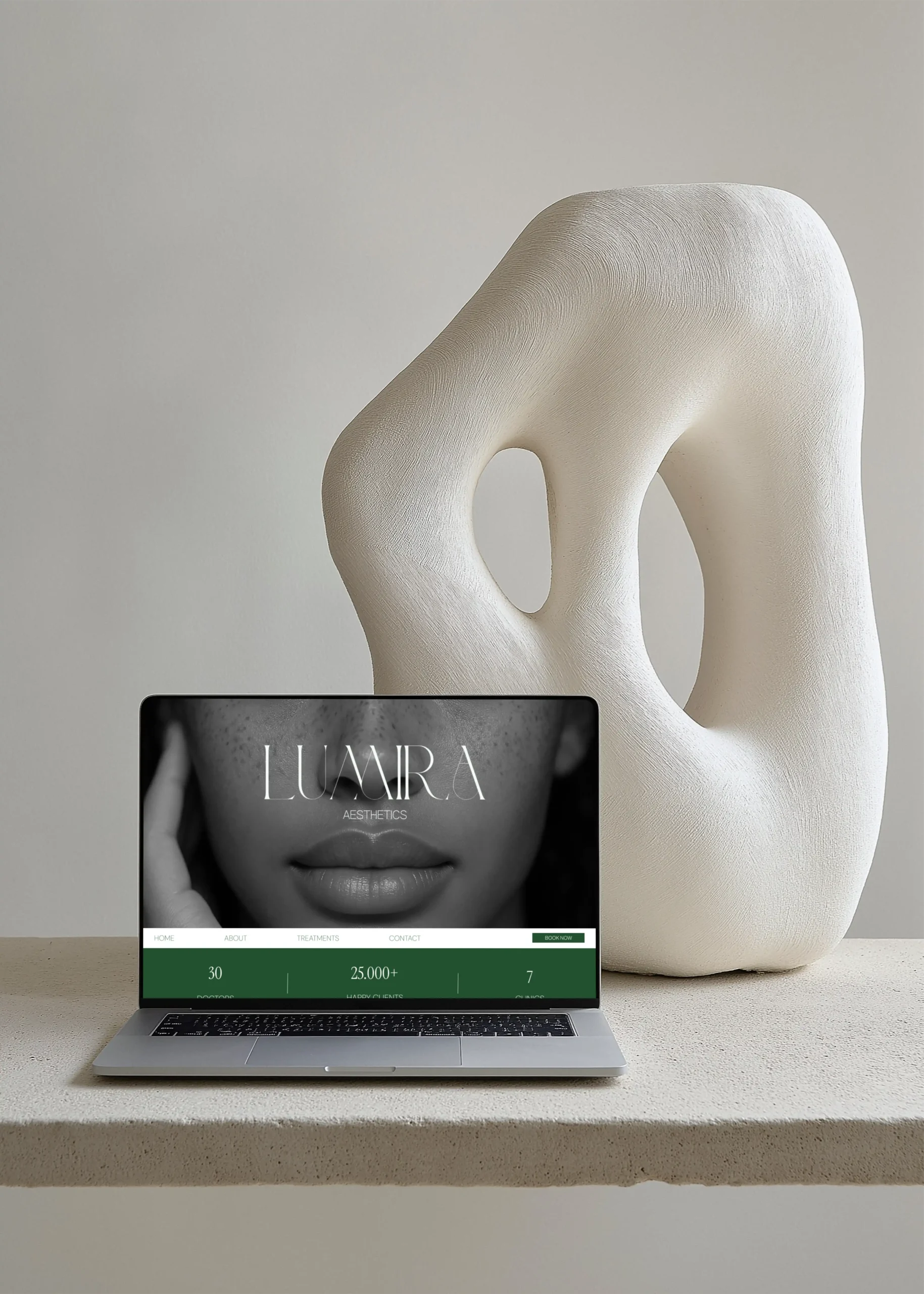 Custom professional web design by Marchella Creative shown on a MacBook, highlighting a modern, high-end website design aesthetic.