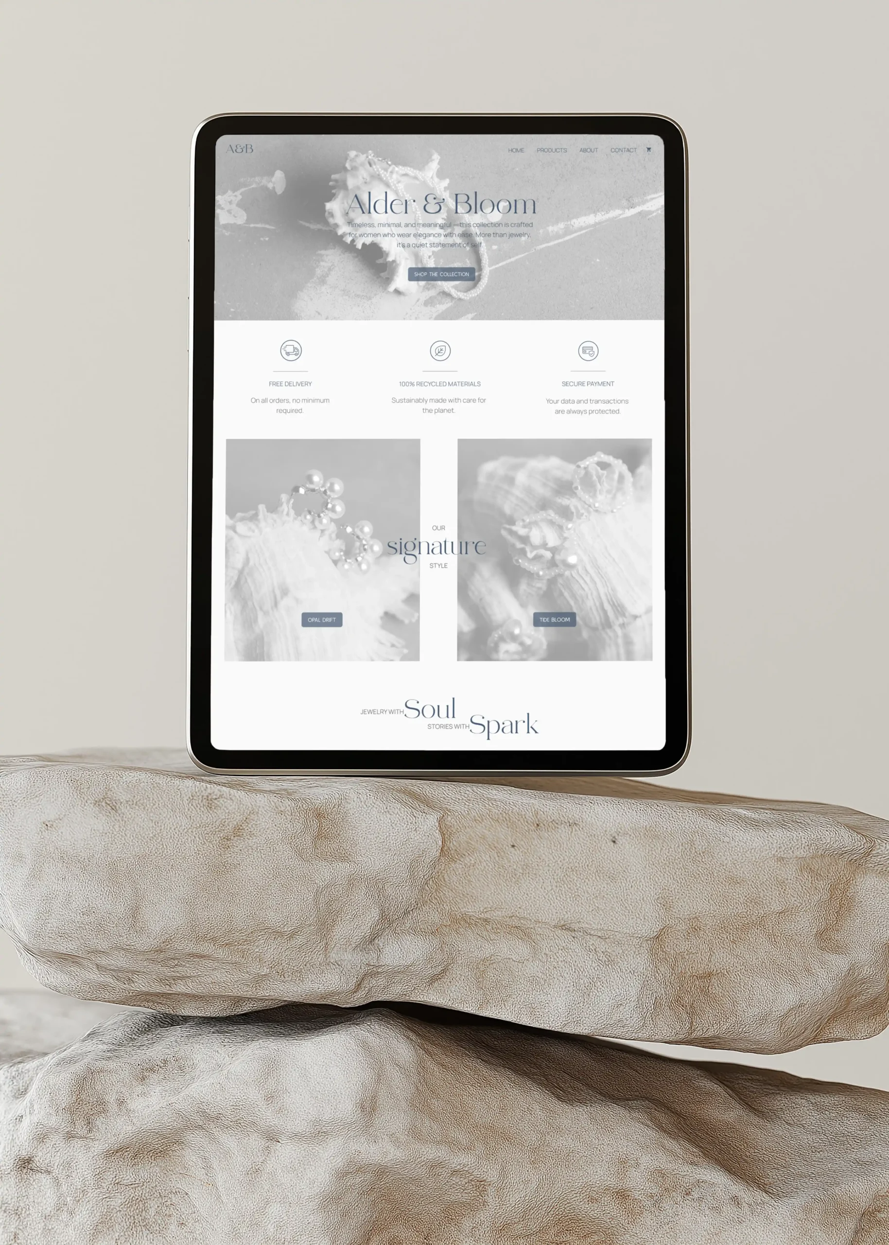 Professional web design by Marchella Creative shown on an iPad mockup, featuring a high-end, minimal e-commerce website design.