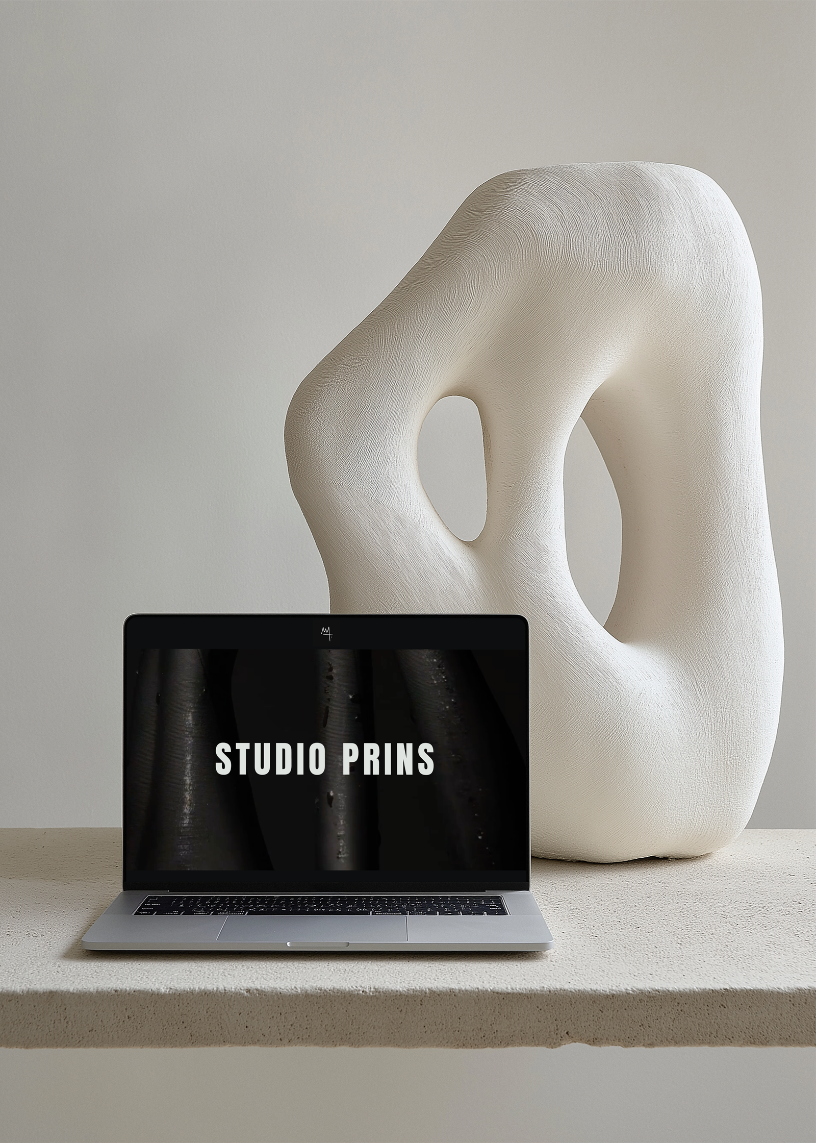 High-end web design by Marchella Creative showcased on a MacBook, featuring a minimalist and editorial website aesthetic.