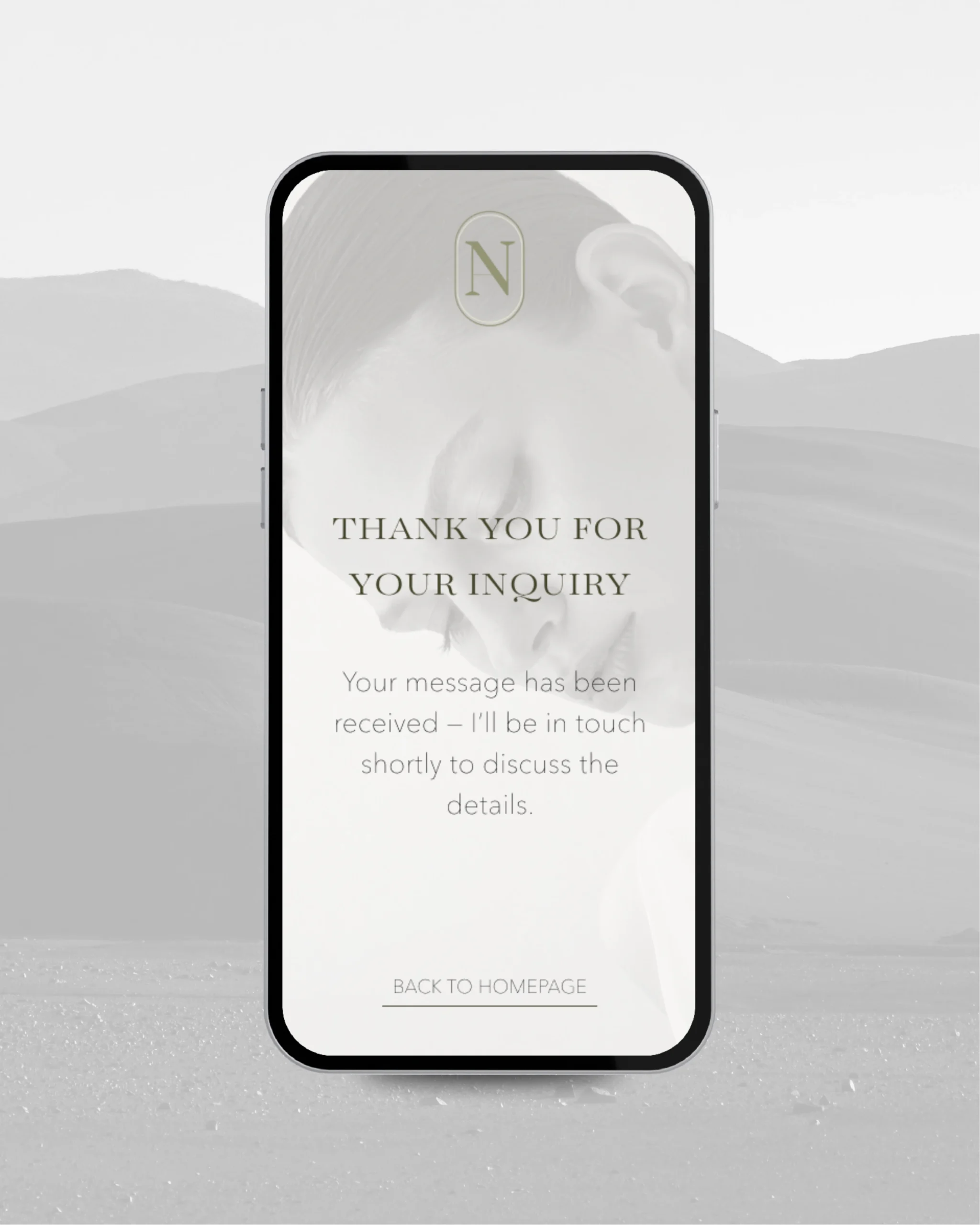 Minimal mobile thank-you screen for Noir Atelier with elegant typography and soft grayscale overlay.