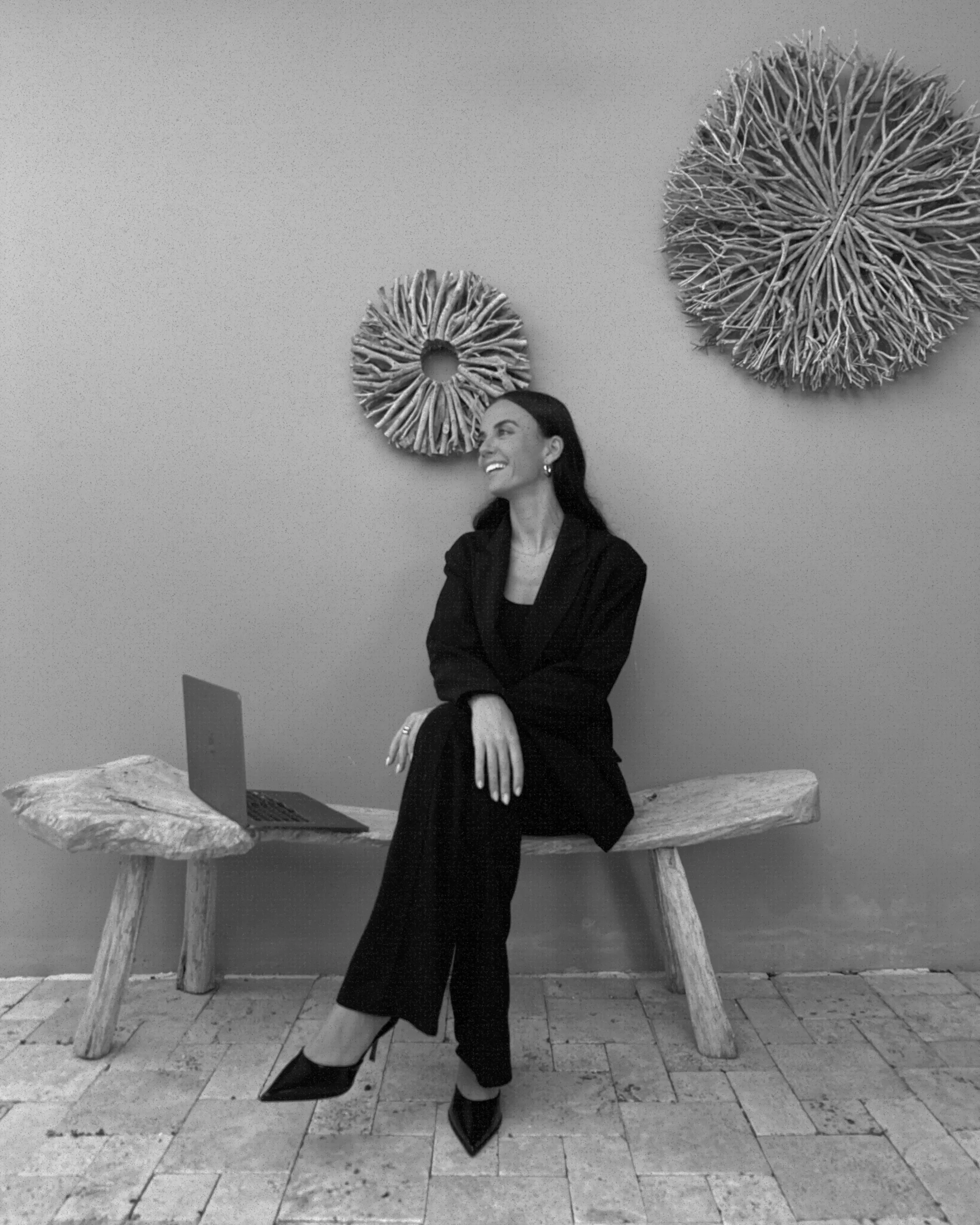 Founder of Marchella Creative, a custom web design studio, working in a calm, minimalist setting that reflects a strategic and design-led approach.